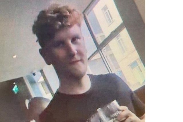 The third is a white man in his early 20s with unkempt curly blond or ginger hair. He was wearing a black t-shirt. Photo from Sussex Police. SUS-211215-175546001