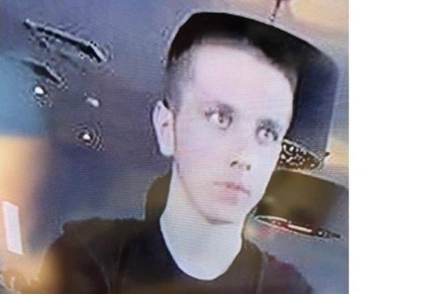 The fifth is a white man with short dark or brown hair. He was wearing a clack t-shirt with a shiny stripe and dark hooded top. Photo from Sussex Police. SUS-211215-175556001