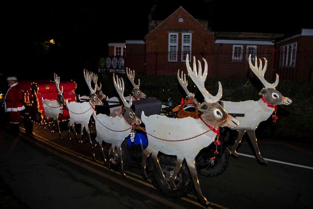 The Santa's Squad Christmas charity float in Stoke Bruerne on Wednesday, December 15 2021. Photo by Kirsty Edmonds.
