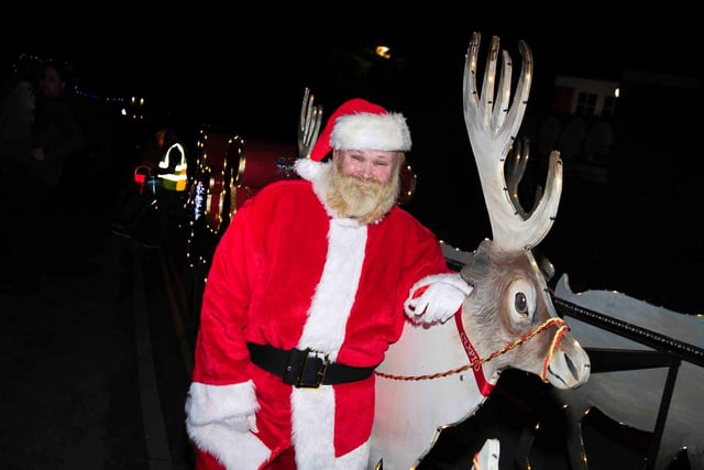 The Santa's Squad Christmas charity float in Stoke Bruerne on Wednesday, December 15 2021. Photo by Kirsty Edmonds.