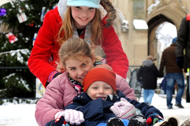 Georgia Hastings pushing her sister India and brother Danny on the sledge in Chichester in December 2010. Picture: Kate Shemilt C102173-1