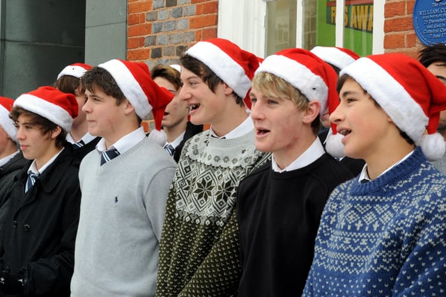 Pupils from Chichester High School for Boys singing carols in East Street in the snow in December 2010. Picture: Kate Shemilt C102173-9