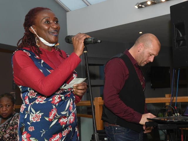 Bamidele Akomolafe, of Lunch Box 5000 at the Storehouse, welcoming guests to the Big Christmas Feast.