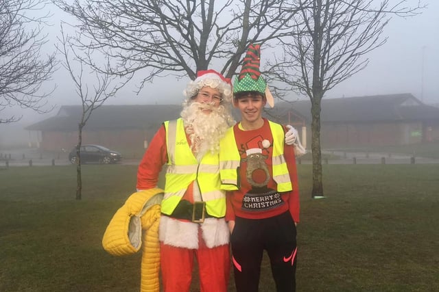 Santa and one of his elves enjoy the run.