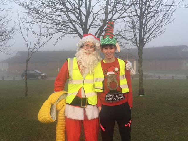 Santa and one of his elves enjoy the run.