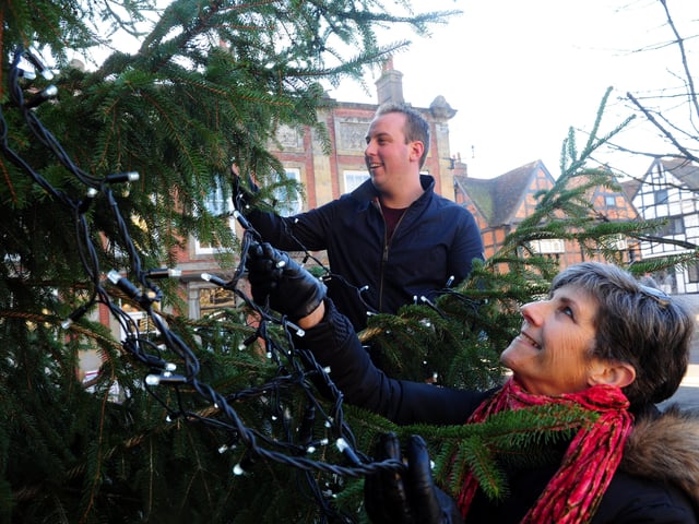 Mark Purves and Lesley Campbell putting lights the Midhurst Christmas tree in The Square in 2016. Picture: Kate Shemilt