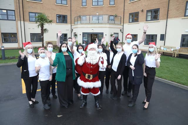 Father Christmas with care home manager Preet Hundal