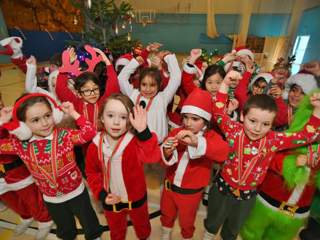 Pupils at The Peterborough School taking part in their annual Santa Smile run. Nat21 EMN-210912-120019009