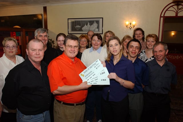 Pictured at the Hospital Club in Thorpe Road are Posties who have raised cash with a panto and have raised 1,100 pounds. Pictured front L-R, are Steven Jones and Leonie Owens from Deaf Blind UK.