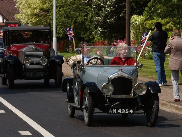 Longthorpe golden jubilee carnival pictured on Thorpe Road with vintage cars leading the parade.