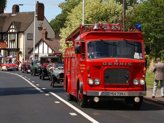 Longthorpe golden jubilee carnival pictured on Thorpe Road with vintage cars leading the parade.