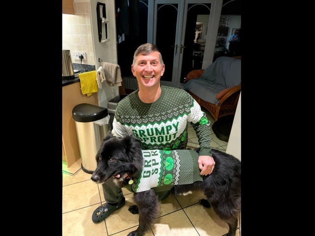 Giles and his dog, Major, in matching Christmas jumpers. From the slogan to the passive aggressive eye roll, I have never seen anything more perfect.