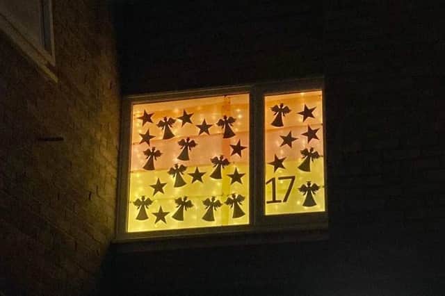 Angels and stars in the festive window for day 17