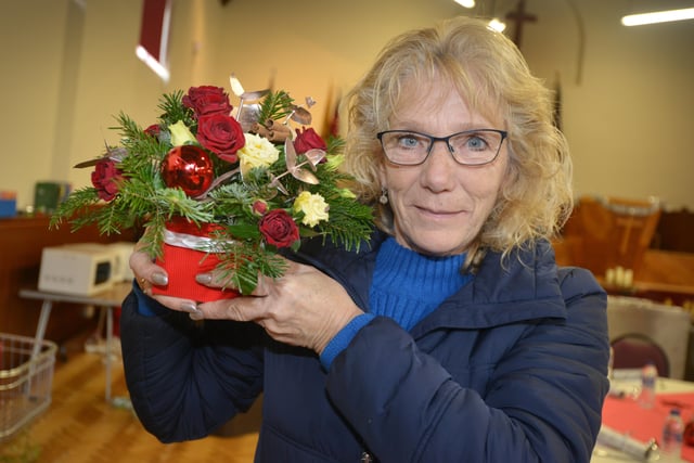 Surviving Christmas volunteers getting ready for Christmas Day at the Salvation Army Hall in Hastings.

Flowers for the event donated by Dorothy Marchant Florists in Bexhill. SUS-211224-133244001