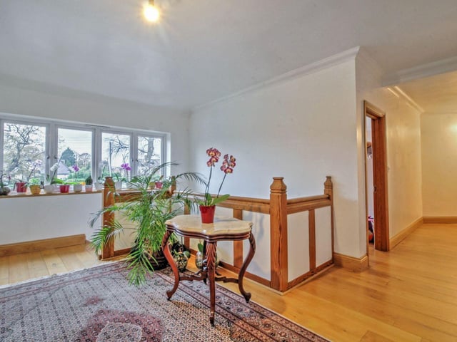 Upstairs the oak staircase takes you to the spacious landing with a large window over looking the front garden.
