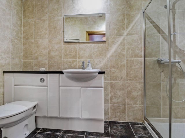 Along the landing are the modern family bathroom and a separate shower room with a large walk-in shower, both fitted to a high standard