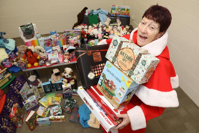 Mother Christmas, retired social worker Jeanette Walsh, with some of the presents donated to the annual gift appeal