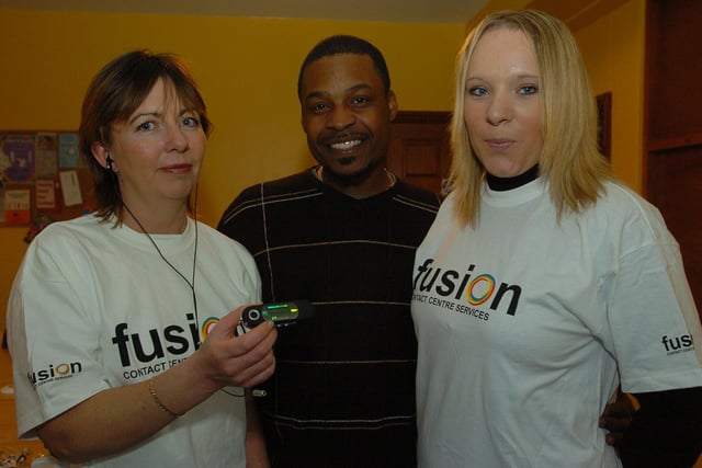 Staff from Fusion have donated MP3 players as christmas gifts to youngsters at children's home in Dogsthorpe Road,
(right) Natalie Dane,  a quality assessor at Fusion, used to live at the children's home. pictured with L-R) Ruth Harper Associate director at Fusion and Residential worker Steve Smith