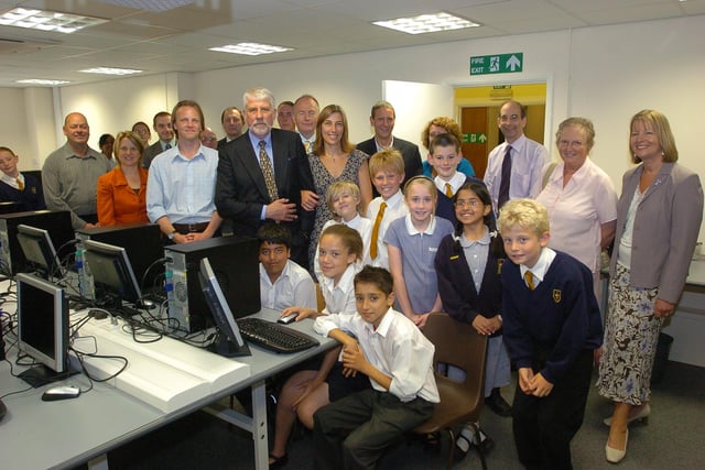 Opening of new IT computer suite at All Saints Junior school, Dogsthorpe Road.(centre L-R) computer teacher Nick Lusher (c) and  former head Edward Husbands are showed new equipment by pupils
