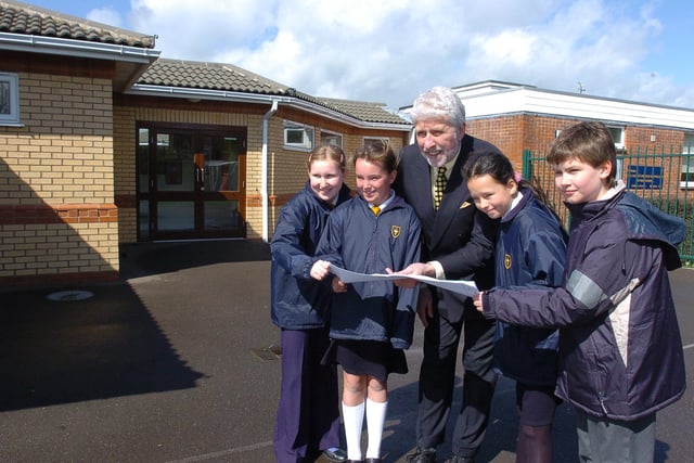 Headteacher from All Saints Church of  England primary school at Dogsthorpe  Road with pupils  Charlotte Holmes, Sophie Nugent, Emma Baruah and James Howes - looking at the plans for a new classroom extension at the school.