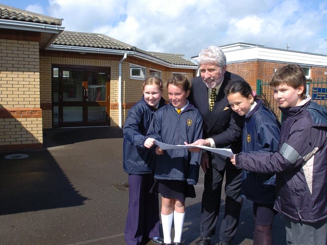 Headteacher from All Saints Church of England primary school at Dogsthorpe Road with pupils Charlotte Holmes, Sophie Nugent, Emma Baruah and James Howes - looking at the plans for a new classroom extension at the school.