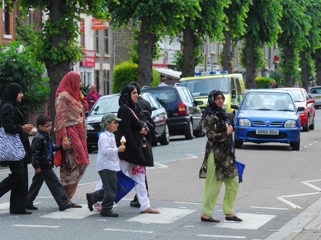 Families using the zebra crossing on Dogsthorpe Road on their way home from Queens Drive School.