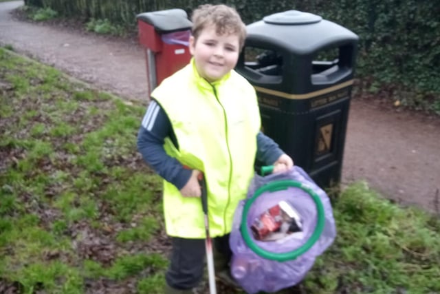 Frankie Cairns, 8, helps clean up Daventry.