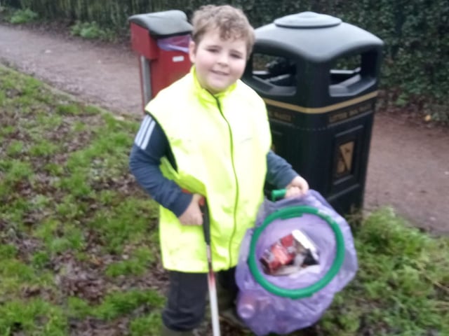 Frankie Cairns, 8, helps clean up Daventry.