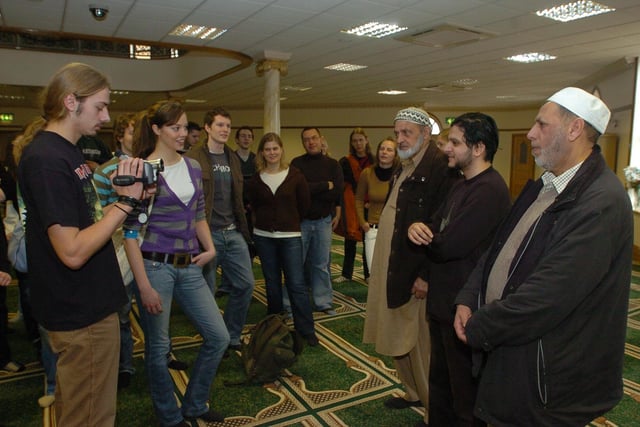 German exchange students, linked with AMVC, on a tour of Gladstone Street mosque. 
L-R) Robert Hoyer (18) and Gina-Lisa Friese (18) filming Mohammed Najib (mosque committee), Faisal Mahmood, on committee for youth group, Gulbrar Khan (mosque committee) pictured in 2007.