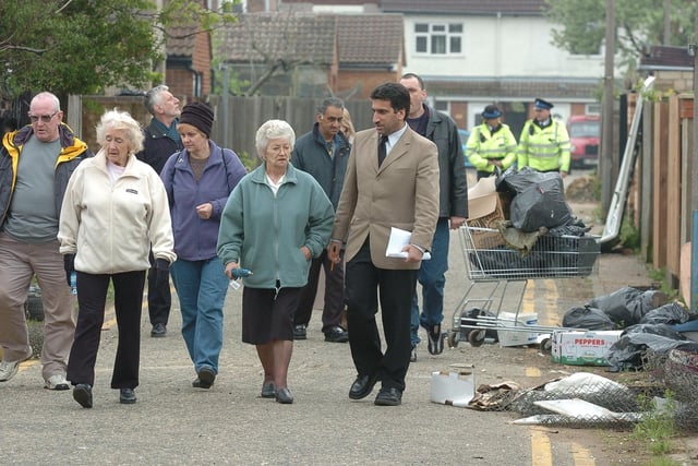 Coun. Mohammed Younis on a walkabout with people who attended his surgery around the Gladstone Street area looking for litter and environmental problems. Can you hrlp us date this picture?