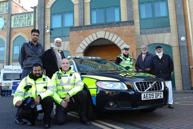PCSO Thomas Puthenpurayil and Sgt Matt Bill [front] at police recruitment visit to the Faizan-E-Madina mosque at Gladstone Street  with visitors and  their chairman Mohammad Younas