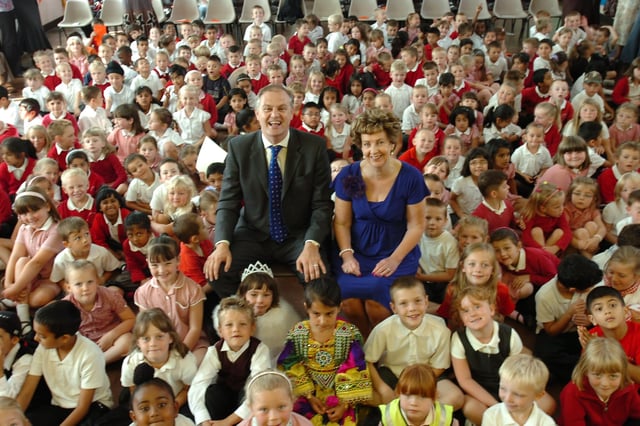 Dogsthorpe infants school  head teacher Gwyneth Mantom with city MP Stewart Jackson and pupils who attended the annual awards ceremony at the school.
