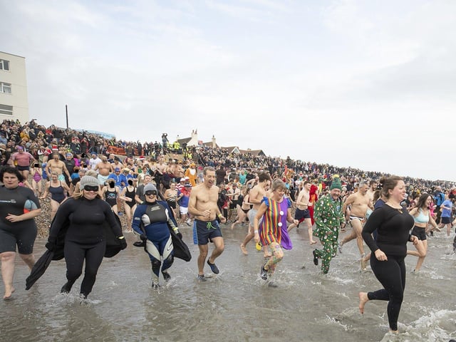 East Wittering New Year Big Dip 2022. Picture from Chris Hatton SUS-220201-110830001