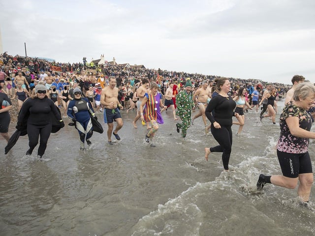 East Wittering New Year Big Dip 2022. Picture from Chris Hatton SUS-220201-110818001