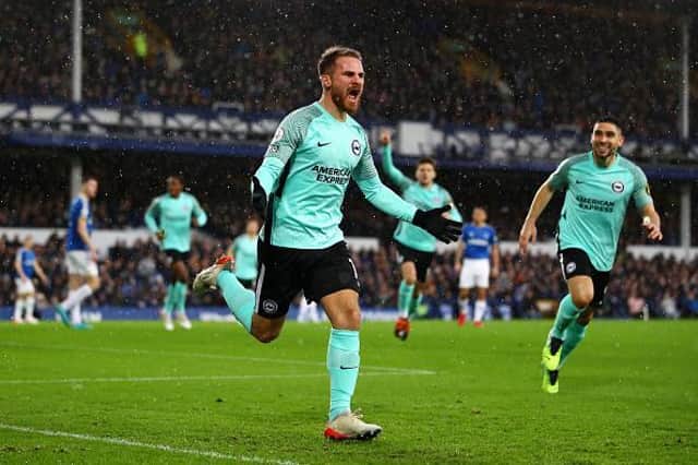 Alexis Mac Allister celebrates his opening goal against Everton