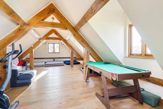 The detached triple garage has a games room above it. Picture: Savills - Haywards Heath.