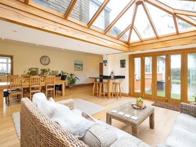 The kitchen, dining room and timber-framed orangery offers a large and versatile space ideal for day-to-day family life. Picture: Savills - Haywards Heath.
