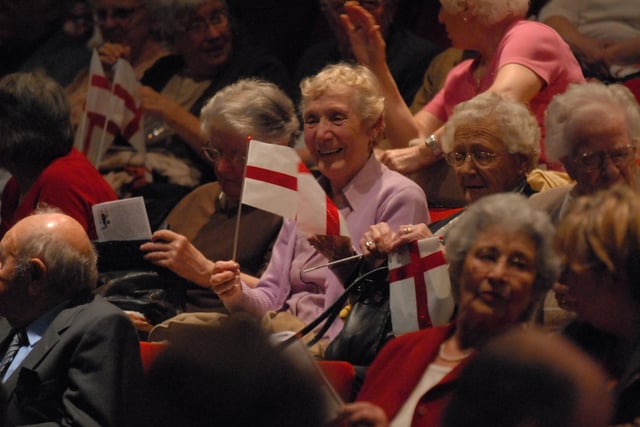 Last Night at the Proms at the Key Theatre in Peterborough. Members of the audience wave the cross of St George.
