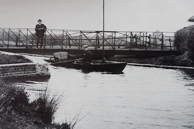 Poyntz Bridge over Chichester Canal at Hunston in about 1909. In November 1989, this swing bridge was being restored by industrial archaeology volunteers, who planned to resite it on the base of a similar bridge between the canal basin and Chichester bypass.
