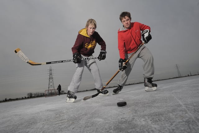 2010: Jack Wicks (15) and Daniel Swan (15) shape up their ice hockey skills on the Whittlesey Washes .