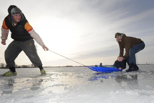 2013: Kayne Worlding, 2, out on the ice at Whittlesey Wash with dad Kym Worlding, 26 and Wayne Daniels, 28, pushing. ENGEMN00120130126141542