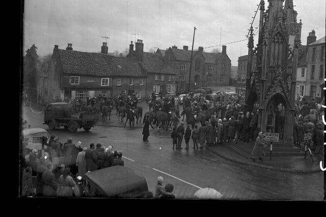 Saddled up for Pytchley Hunt in Daventry town centre in December, 1960.