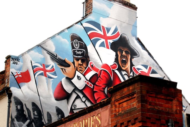 This picture was taken in 2013 - the caption reads: "The Volunteer, Wellingborough Road, Northampton - spray can art on side of building, an artist was commissioned to do it, it's a scene from British Empire"