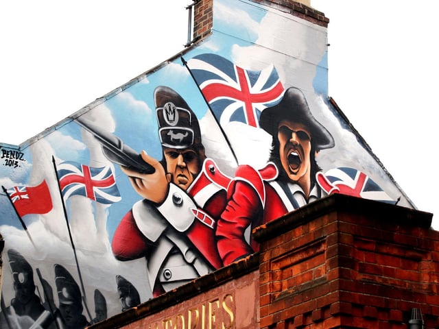 This picture was taken in 2013 - the caption reads: "The Volunteer, Wellingborough Road, Northampton - spray can art on side of building, an artist was commissioned to do it, it's a scene from British Empire"