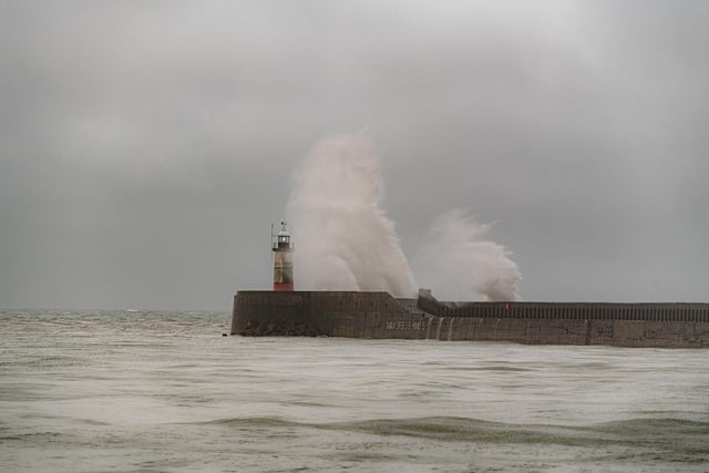 Waves slam against the harbour wall at Newhaven as heavy rain and 40 mile an hour winds batter the south coast of Britain