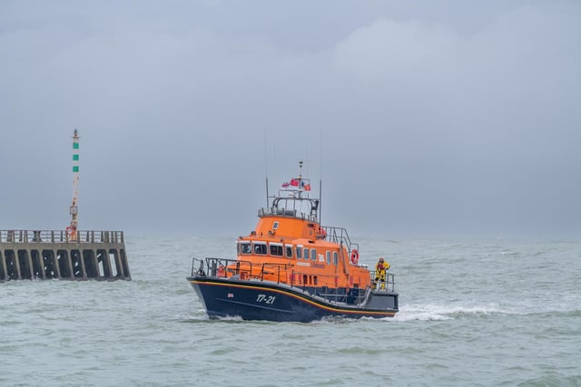 The RNLI lifeboat returns to base at Newhaven as heavy rain and 40 mile an hour winds batter the south coast of Britain.