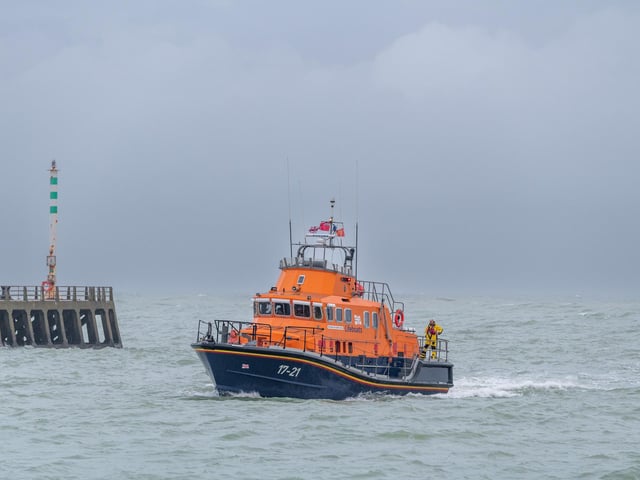 The RNLI lifeboat returns to base at Newhaven as heavy rain and 40 mile an hour winds batter the south coast of Britain.