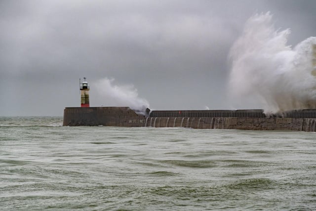 Waves slam against the harbour wall at Newhaven as heavy rain and 40 mile an hour winds batter the south coast of Britain