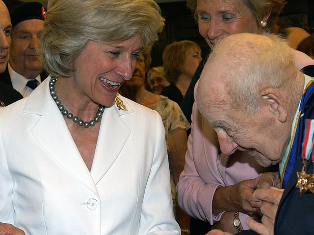 The Duchess of Gloucester is presented with a birthday card by
110 -year-old Henry Allingham. Picture: Stephen Goodger W25390p6