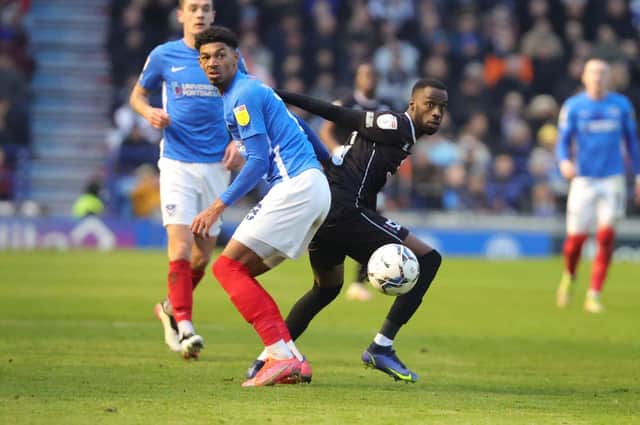 Mo Eisa battles for the ball during Dons' win over Portsmouth